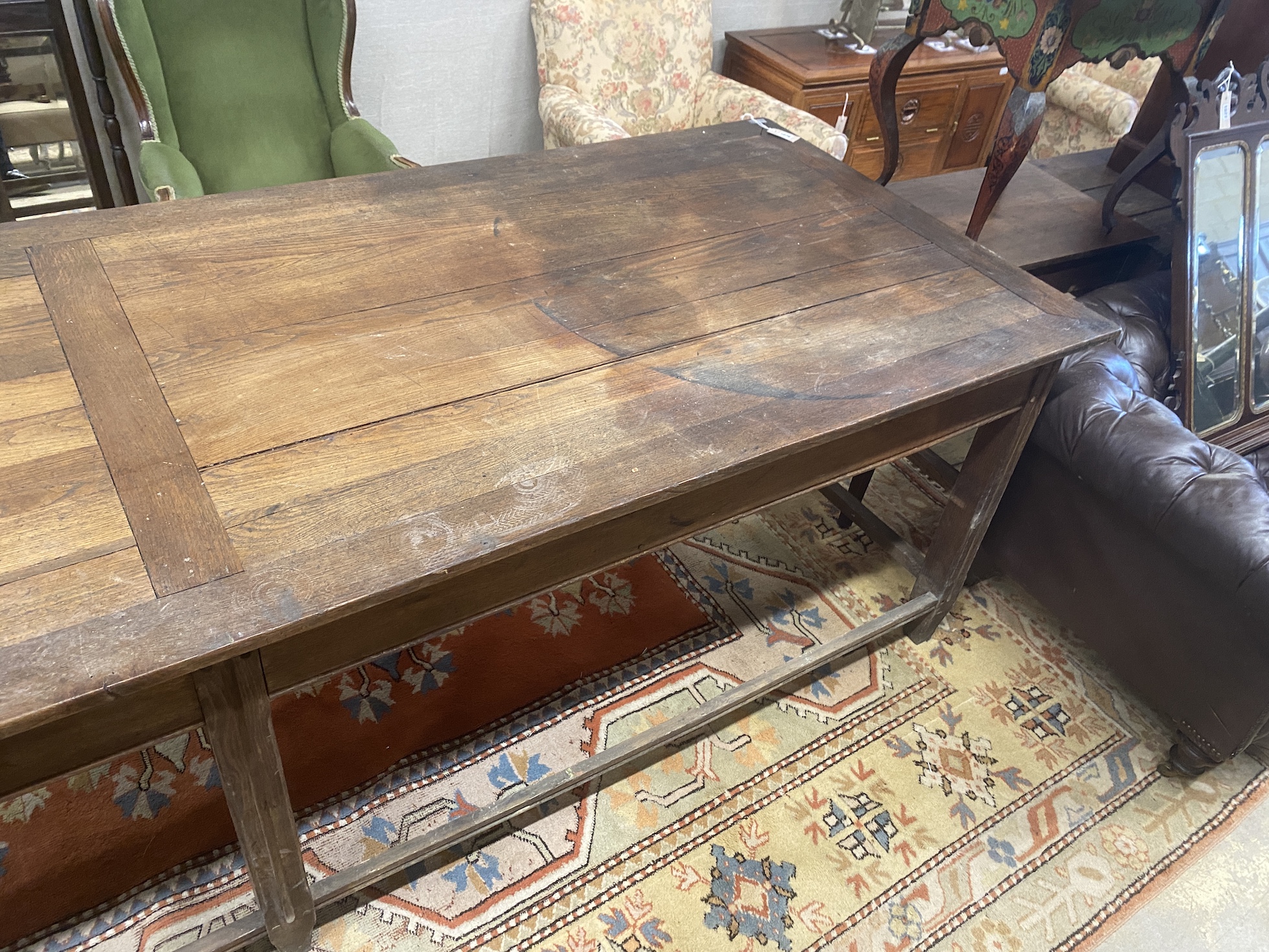 A 19th century French oak serving table, length 300cm, depth 100cm, height 85cm